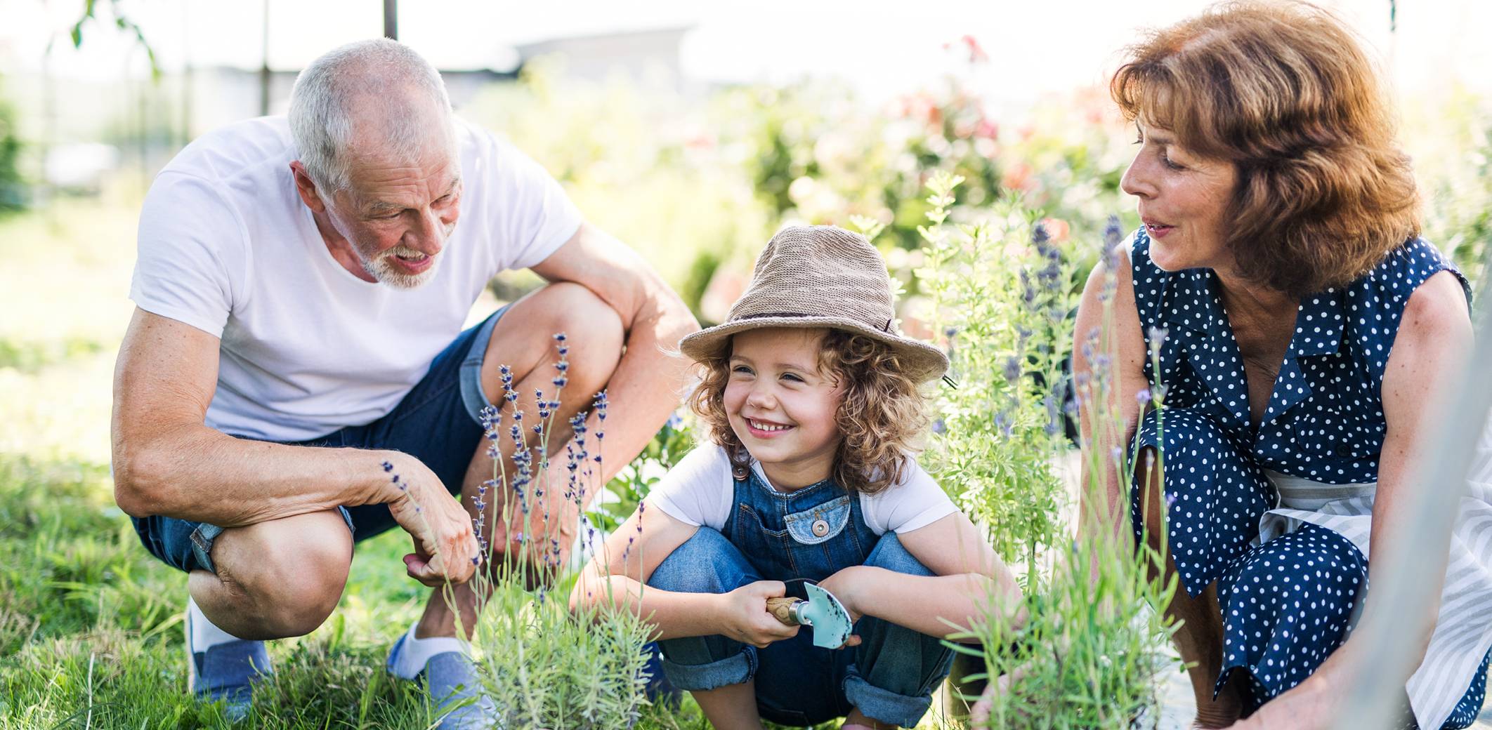 girl-with-grandparents-backyard
