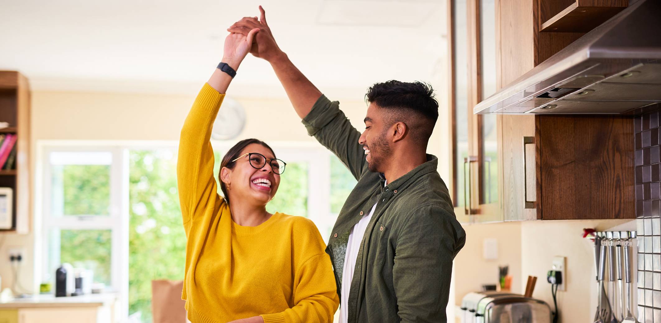 young-couple-dancing-in-kitchen