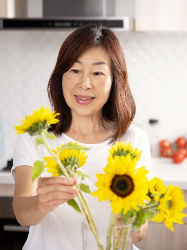senior-asian-woman-sunflower